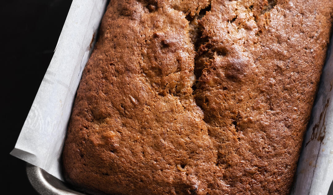 Loaf of Whole Grain Roasted Banana Bread in the pan
