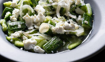 Bowl of Smashed Cucumbers With Feta & Dill Pickle Dressing