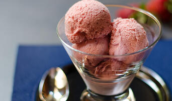 Scoops of eggless roasted strawberry ice cream.