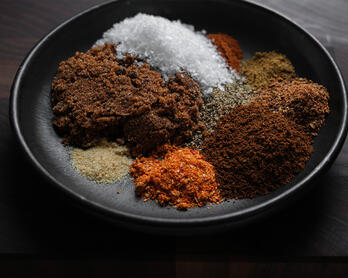 Plate displaying ingredients for a coffee and chile dry rub.