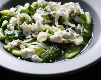 Bowl of Smashed Cucumbers With Feta & Dill Pickle Dressing
